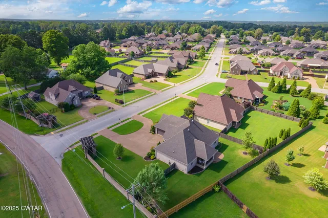 an aerial view of a house with a garden