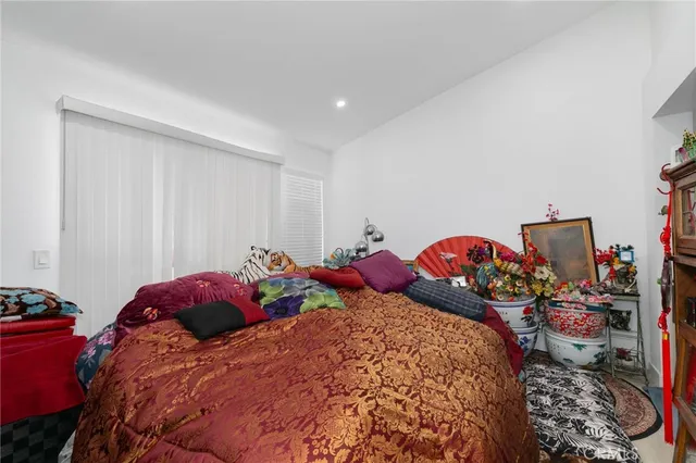 a bedroom with bed and a closet