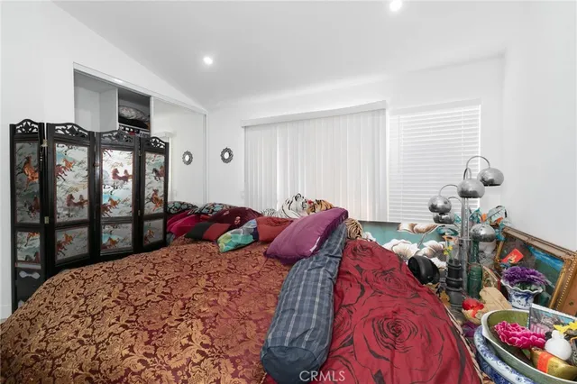 a bed room with a bed and a tv