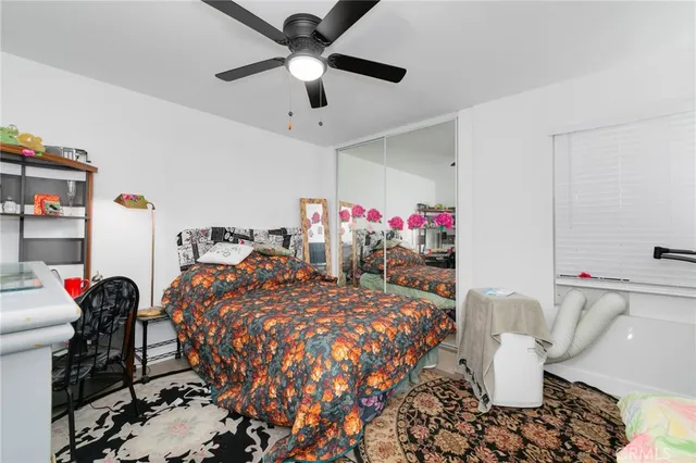 a bed room with a bed and a chandelier