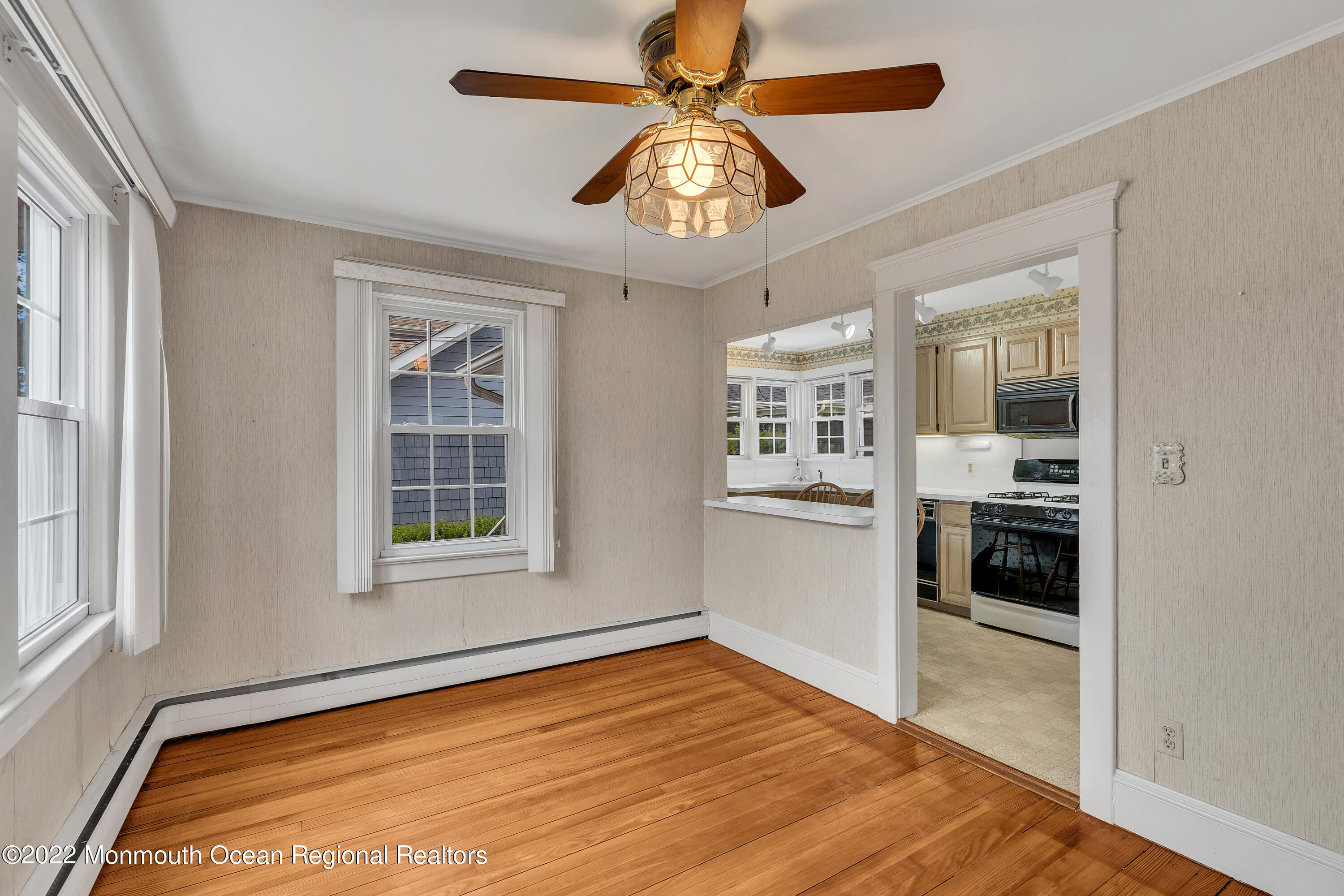 1107 5th Avenue Spring Lake, NJ 07762 - Photo 14 of 30 a view of an empty room with a window and kitchen view