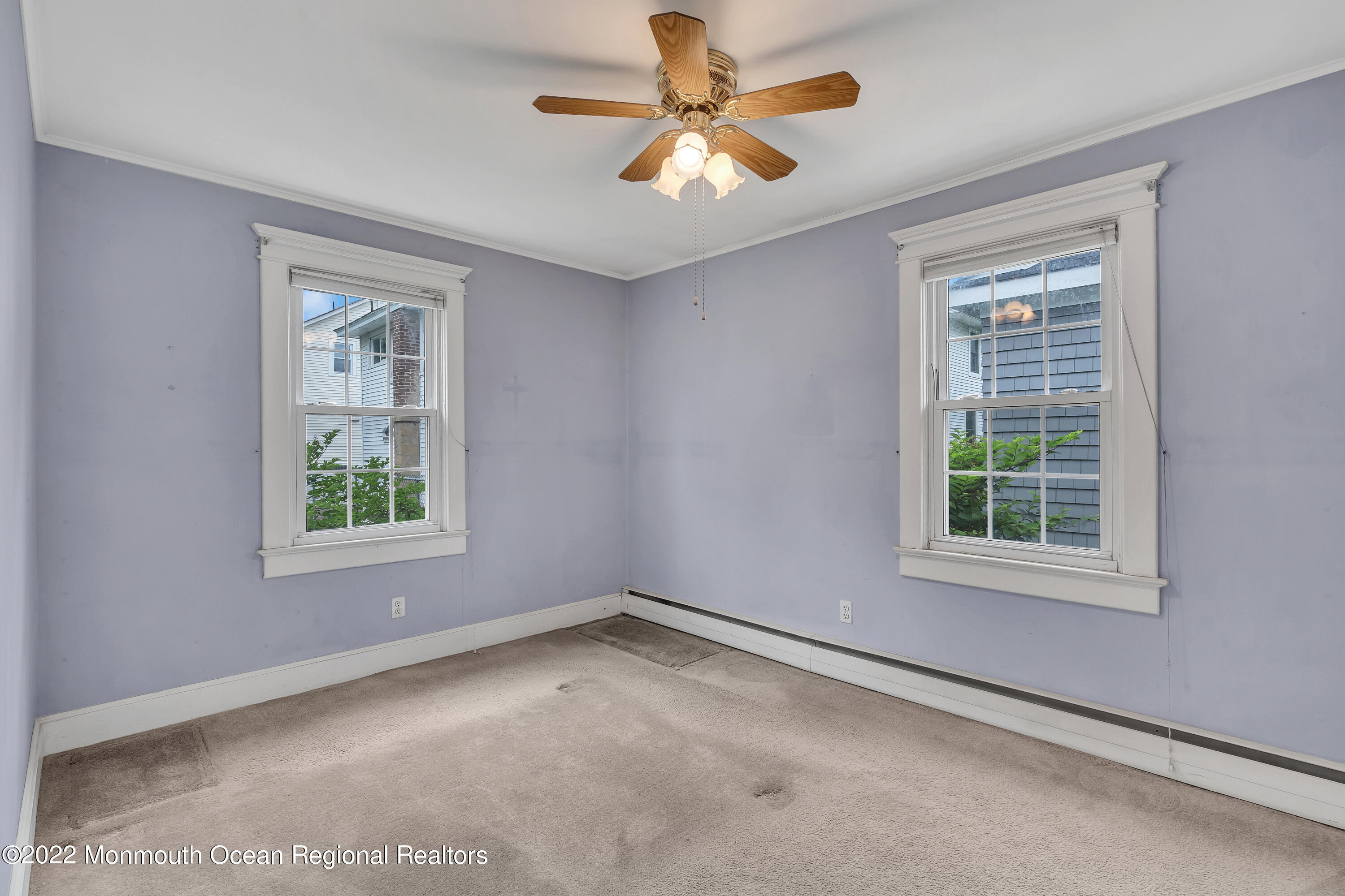 1107 5th Avenue Spring Lake, NJ 07762 - Photo 21 of 30 an empty room with a window and a fan