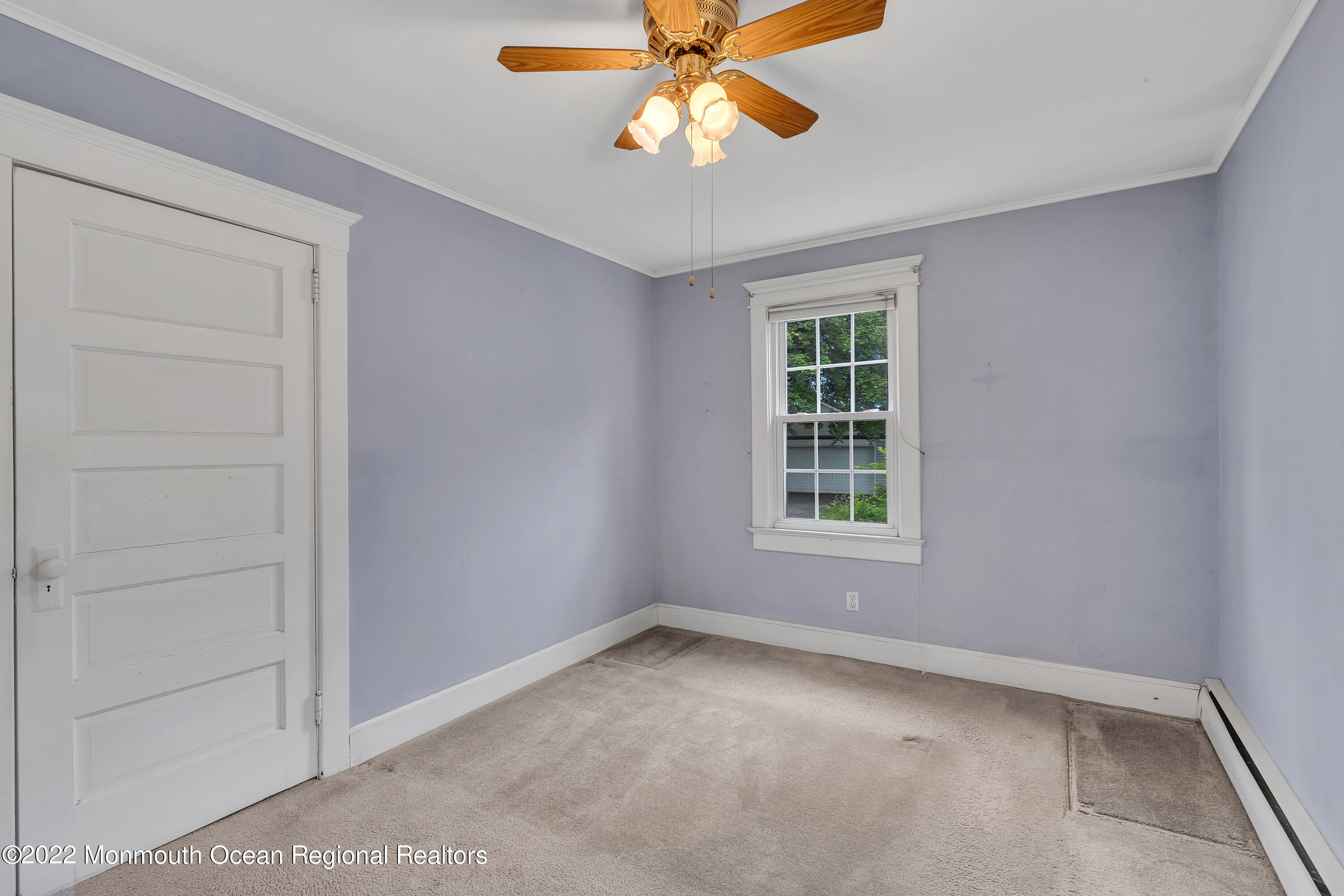 1107 5th Avenue Spring Lake, NJ 07762 - Photo 22 of 30 an empty room with a window and a fan
