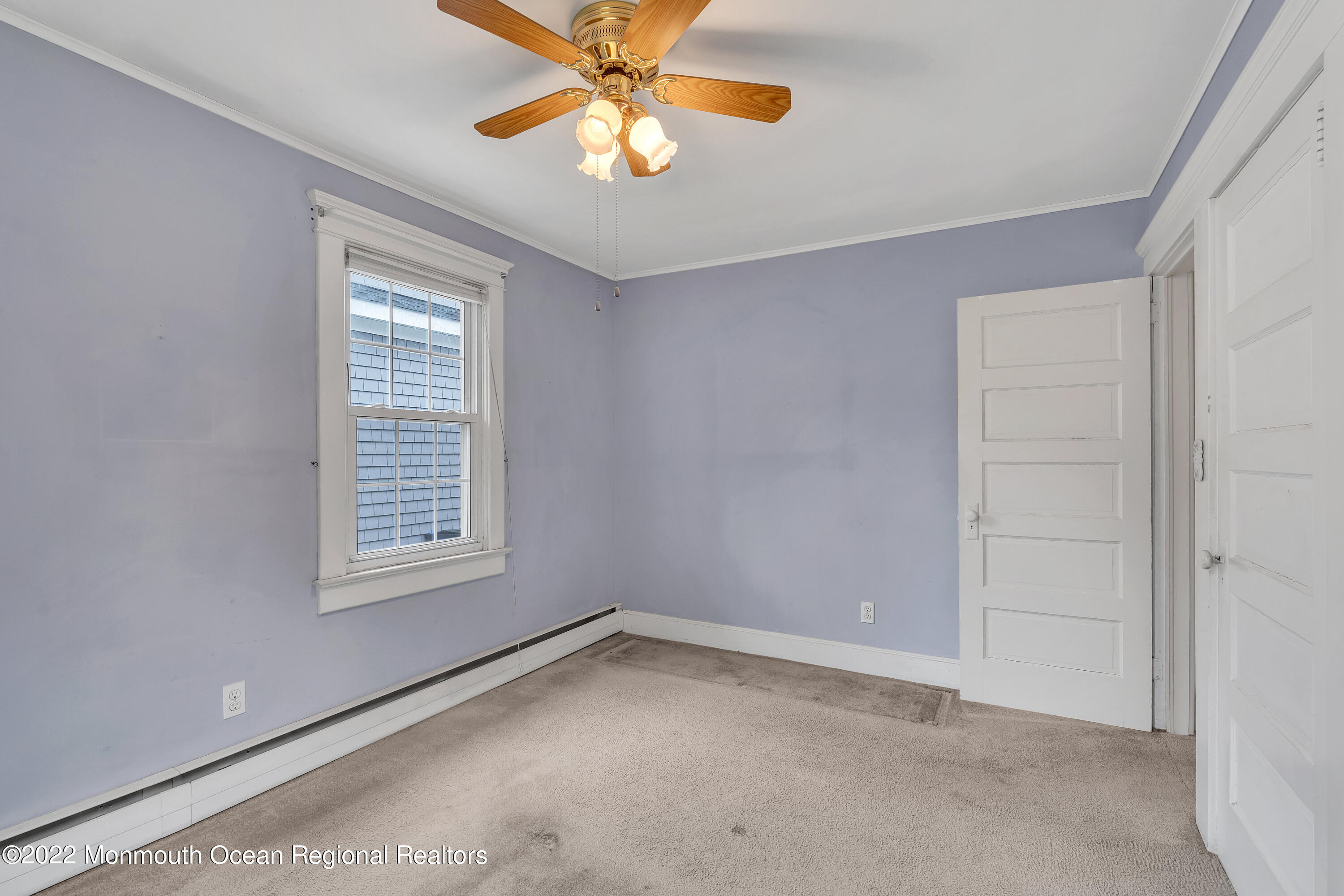 1107 5th Avenue Spring Lake, NJ 07762 - Photo 23 of 30 an empty room with windows and fan