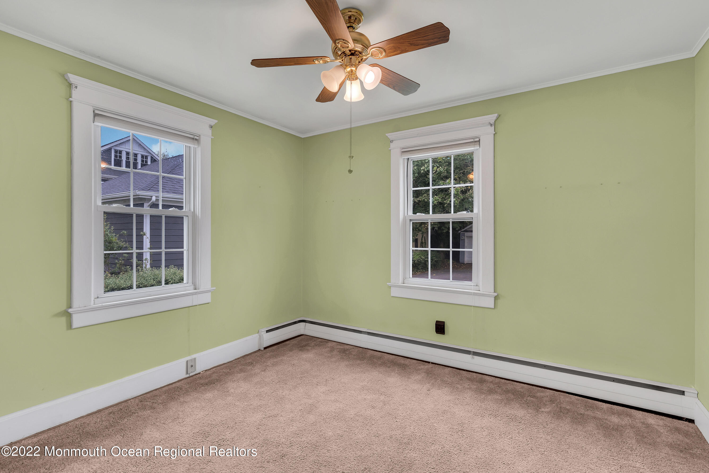 1107 5th Avenue Spring Lake, NJ 07762 - Photo 25 of 30 an empty room with a window and a fan