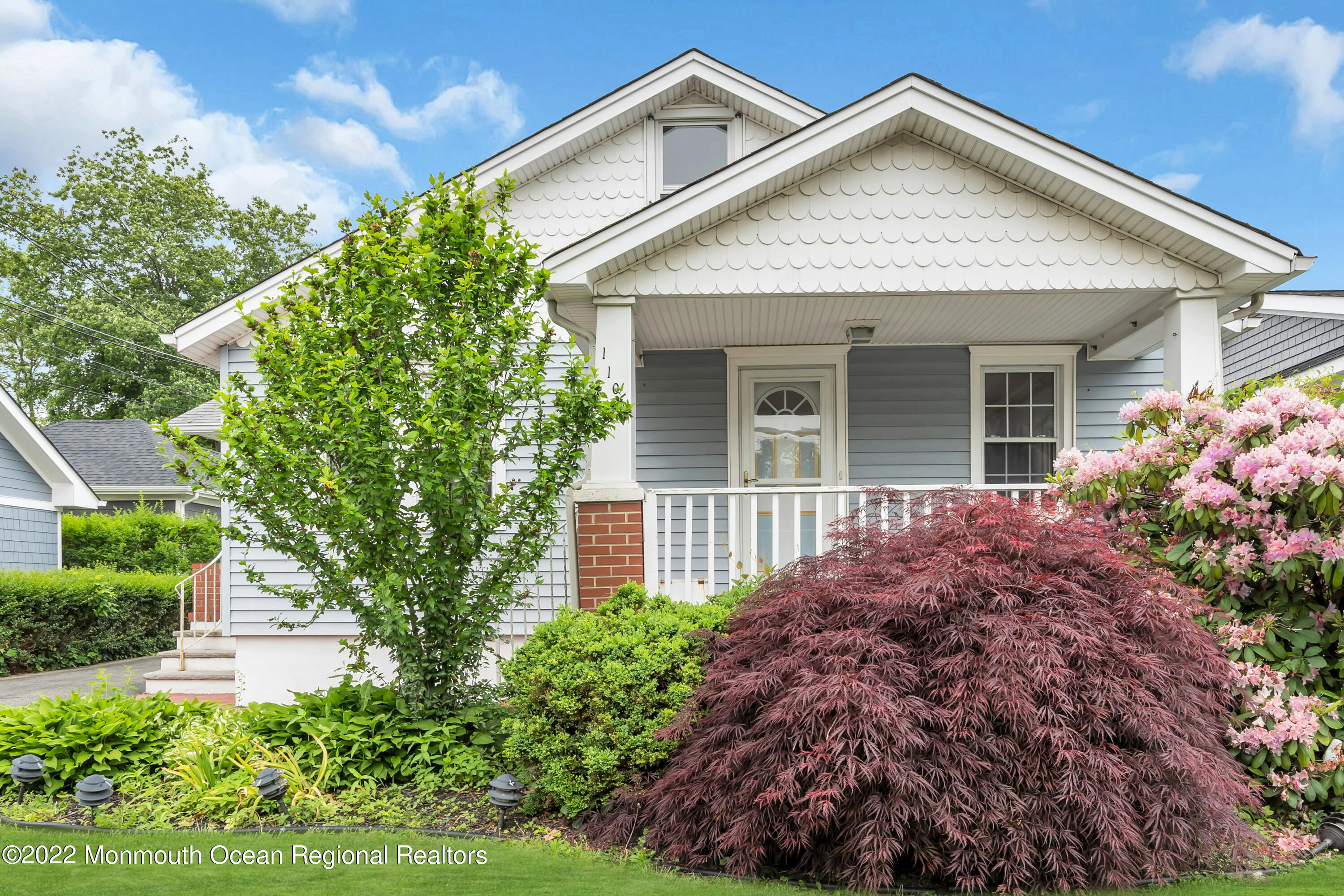 1107 5th Avenue Spring Lake, NJ 07762 - Photo 4 of 30 front view of a house with a yard
