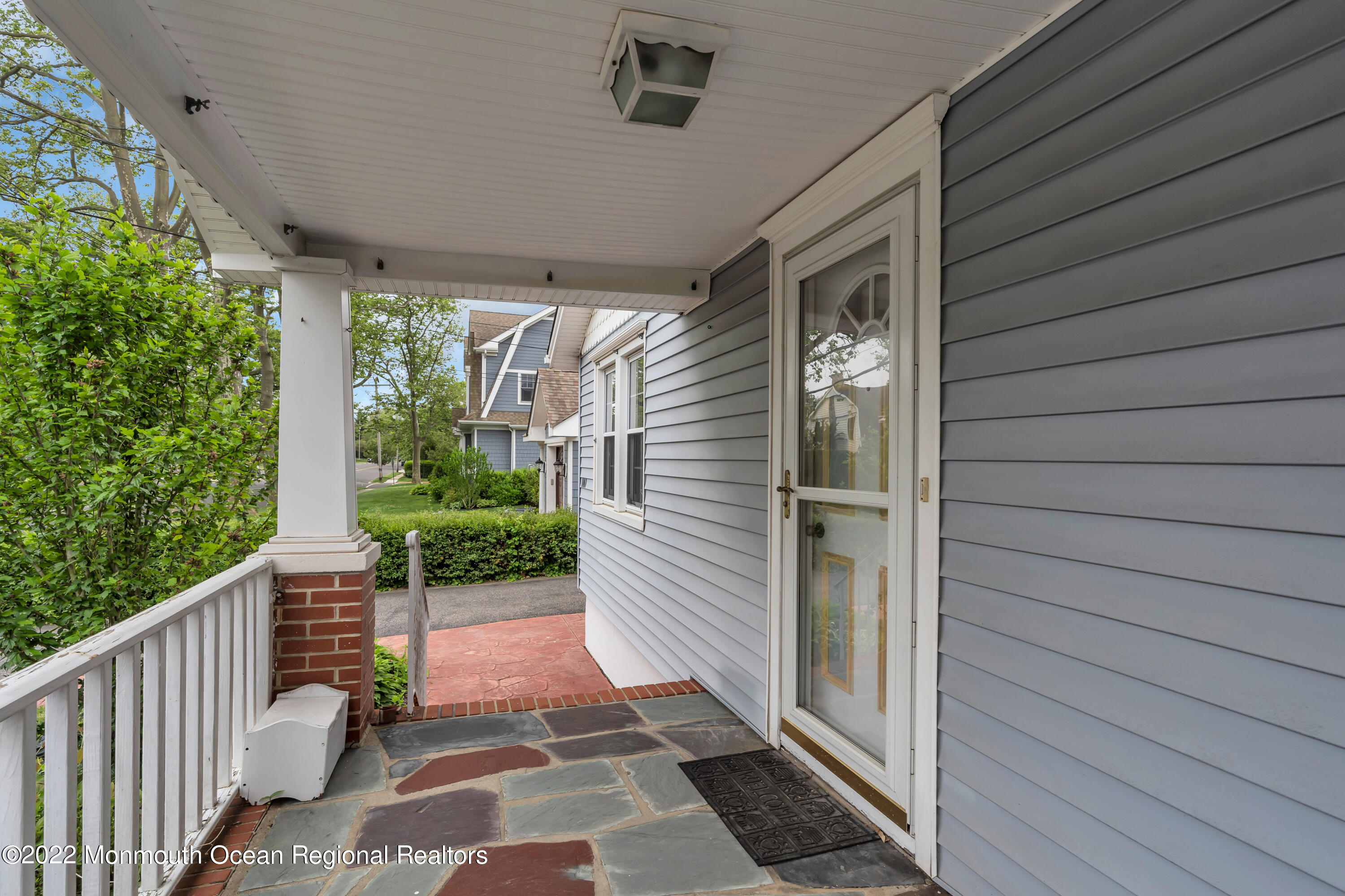1107 5th Avenue Spring Lake, NJ 07762 - Photo 9 of 30 a porch with seating space