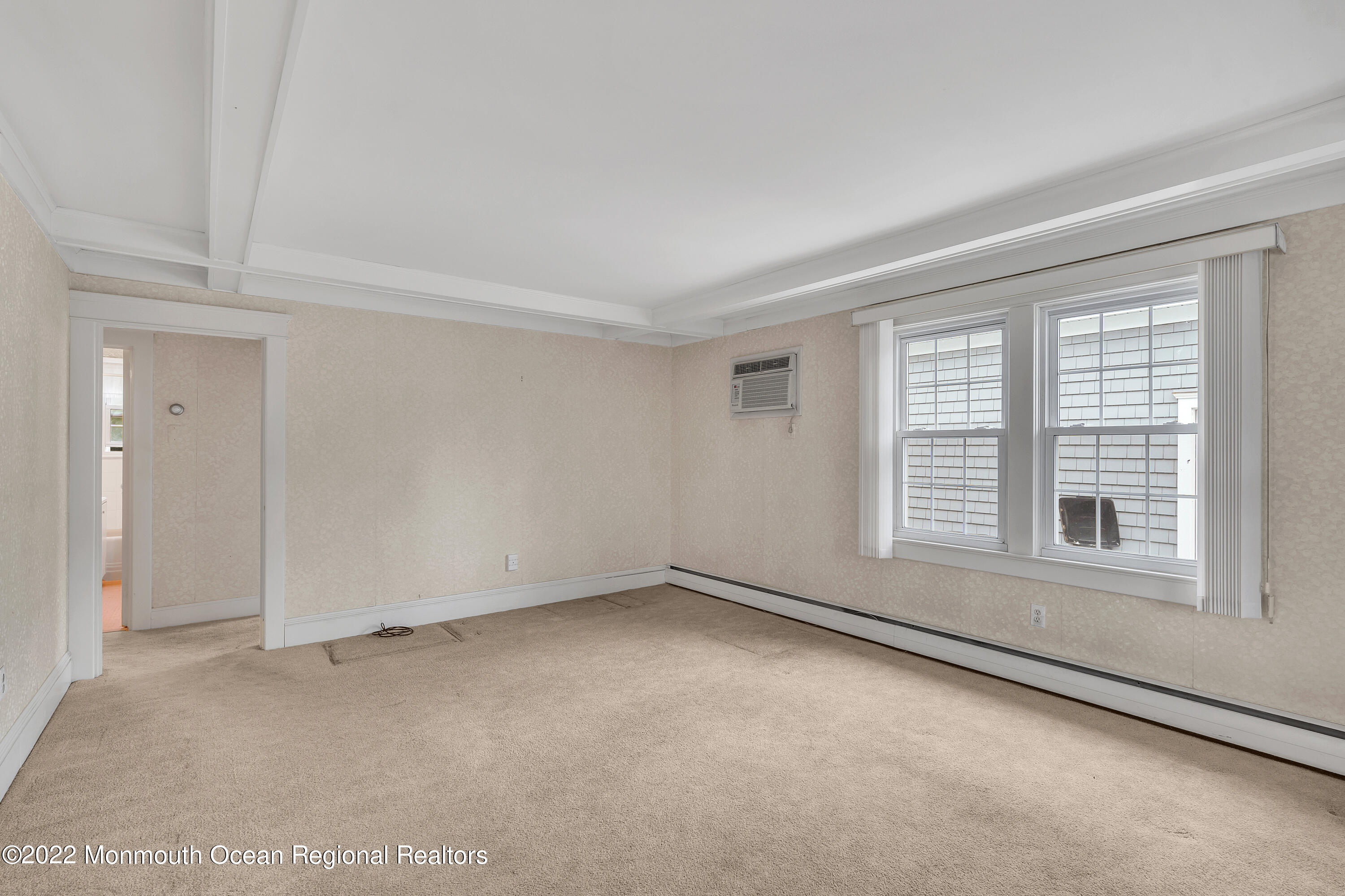 1107 5th Avenue Spring Lake, NJ 07762 - Photo 10 of 30 an empty room with a empty space and windows
