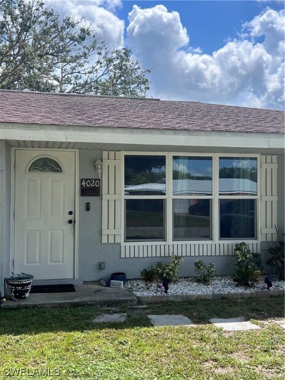 4020 Rainbow Circle LaBelle, FL 33935 - Photo 13 of 30 a front view of a house with a yard