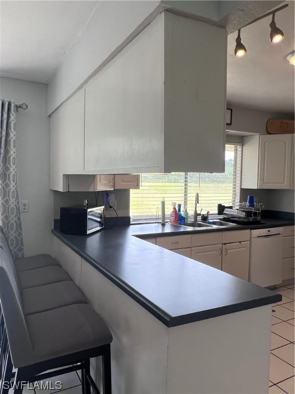 4020 Rainbow Circle LaBelle, FL 33935 - Photo 19 of 30 a kitchen with stainless steel appliances a sink cabinets and wooden floor