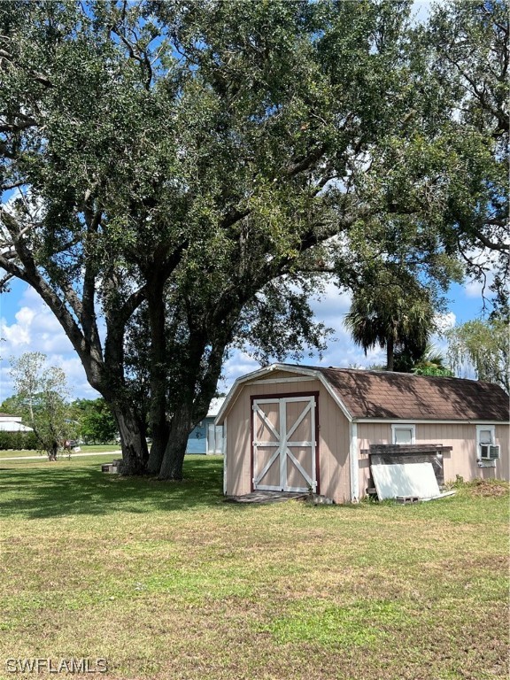 4020 Rainbow Circle LaBelle, FL 33935 - Photo 6 of 30 a front view of a house with garden