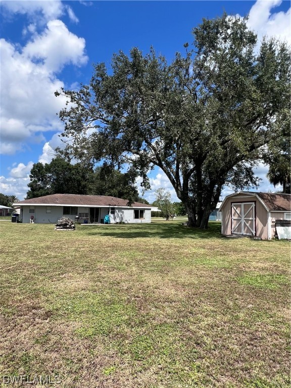 4020 Rainbow Circle LaBelle, FL 33935 - Photo 7 of 30 a front view of a house with a yard