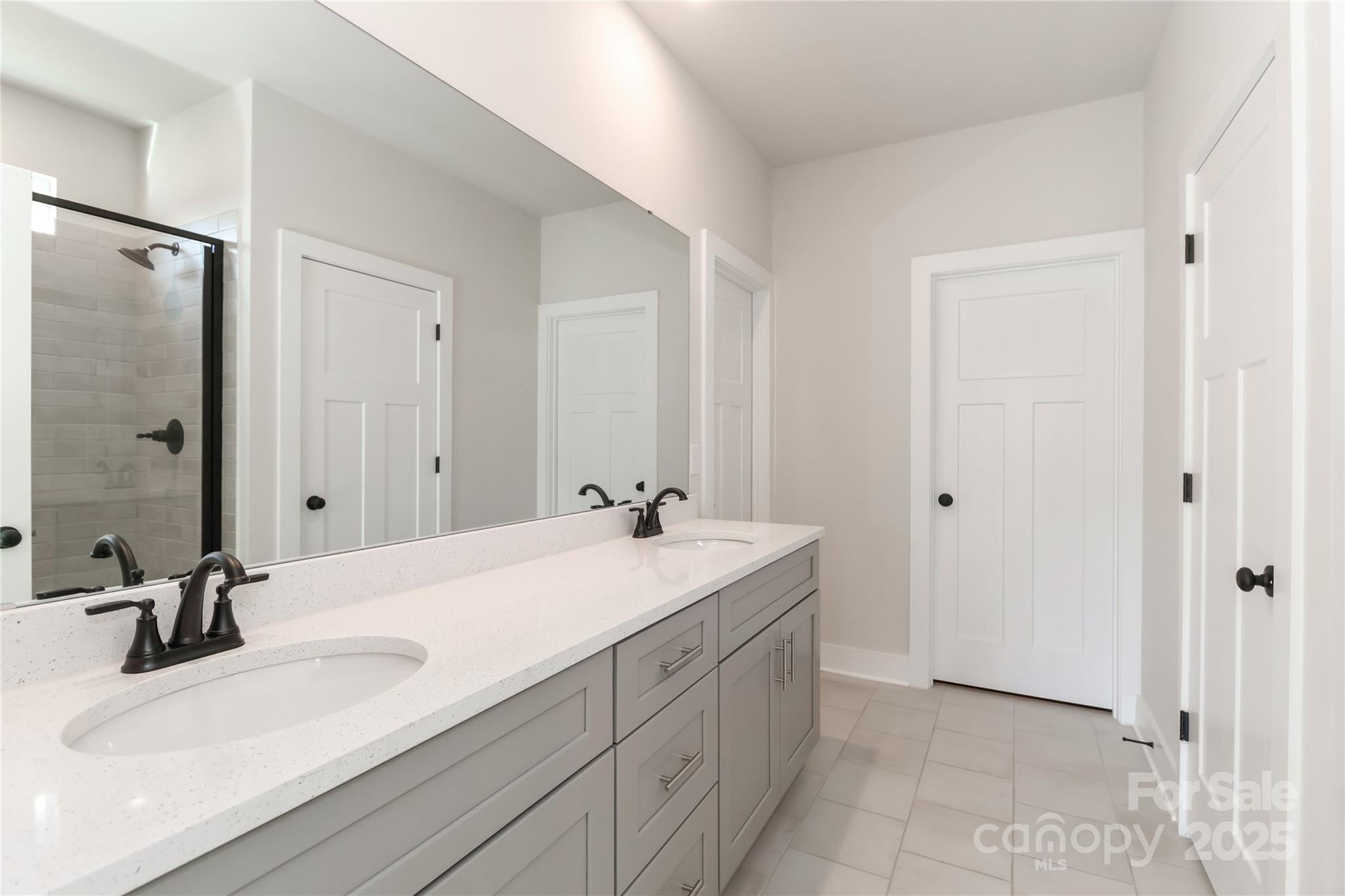 269 Monticello Road Statesville, NC 28625 - Photo 20 of 31 a bathroom with a sink and a mirror