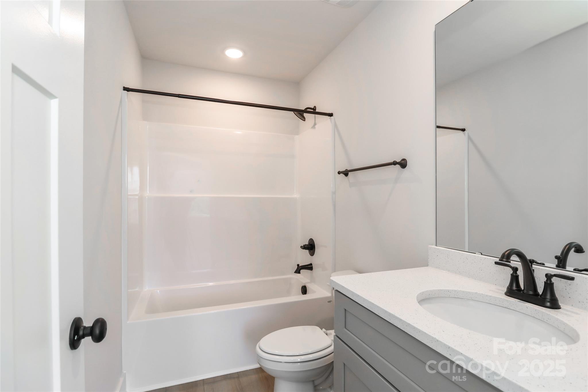 269 Monticello Road Statesville, NC 28625 - Photo 26 of 31 a bathroom with a granite countertop sink toilet and shower