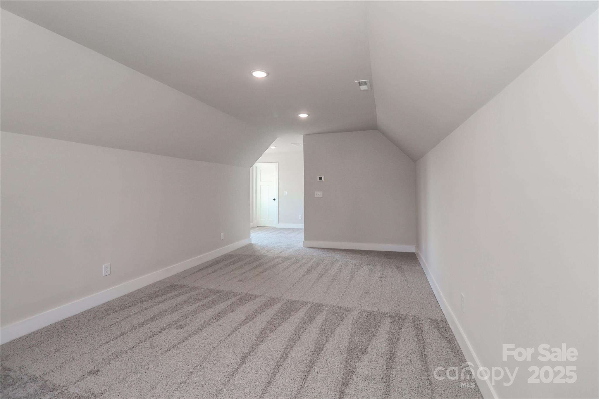 269 Monticello Road Statesville, NC 28625 - Photo 27 of 31 a view of an empty room and wooden floor