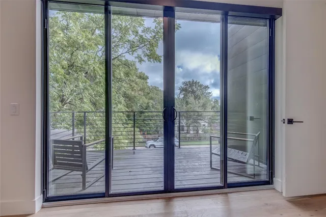 a view of a glass door and the window