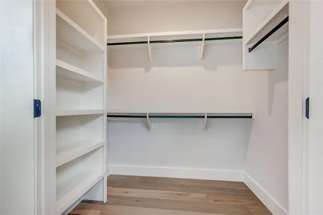 a view of an empty walk in closet