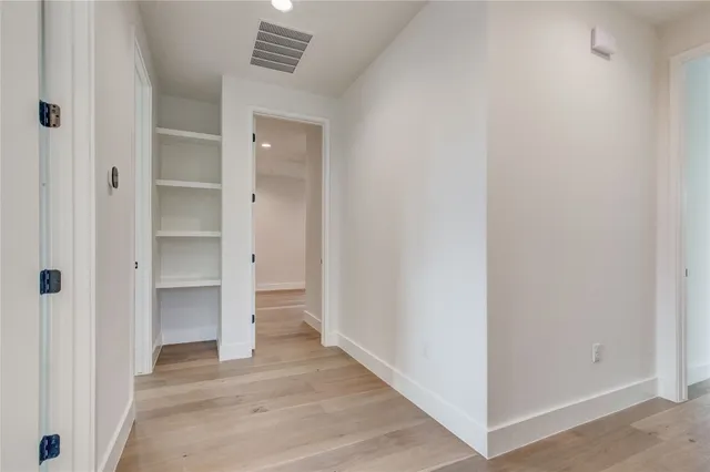 a view of an empty walk in closet