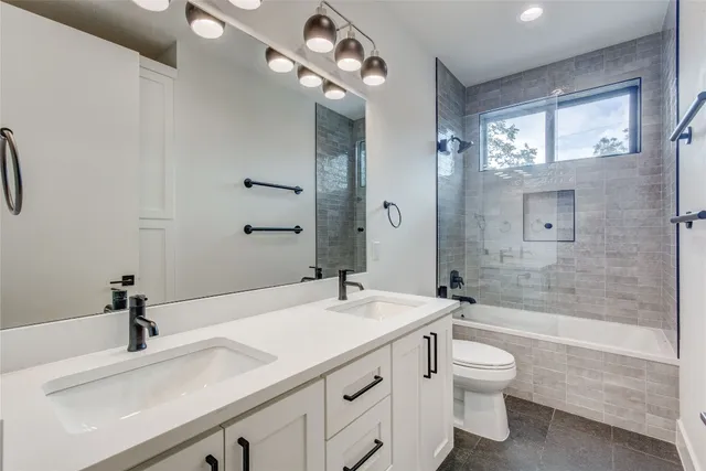 a bathroom with a sink a toilet and a bathtub