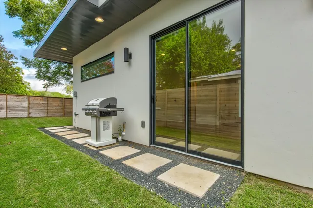 a backyard with table and chairs