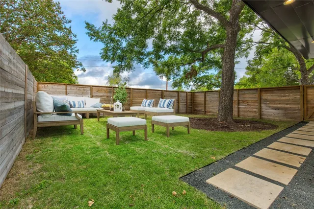 a view of a bench in the backyard