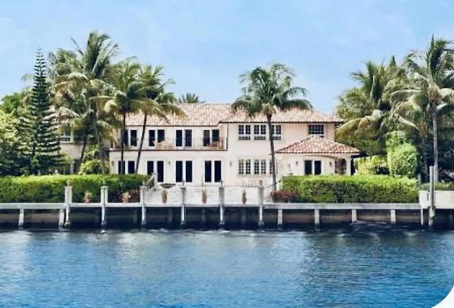 a view of a house with pool and a yard