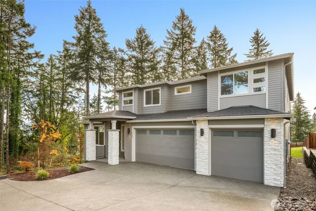 a front view of a house with a garage