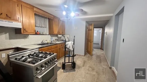 a kitchen with a stove and a sink