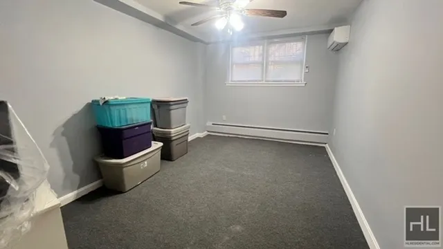 an empty room with windows and closet