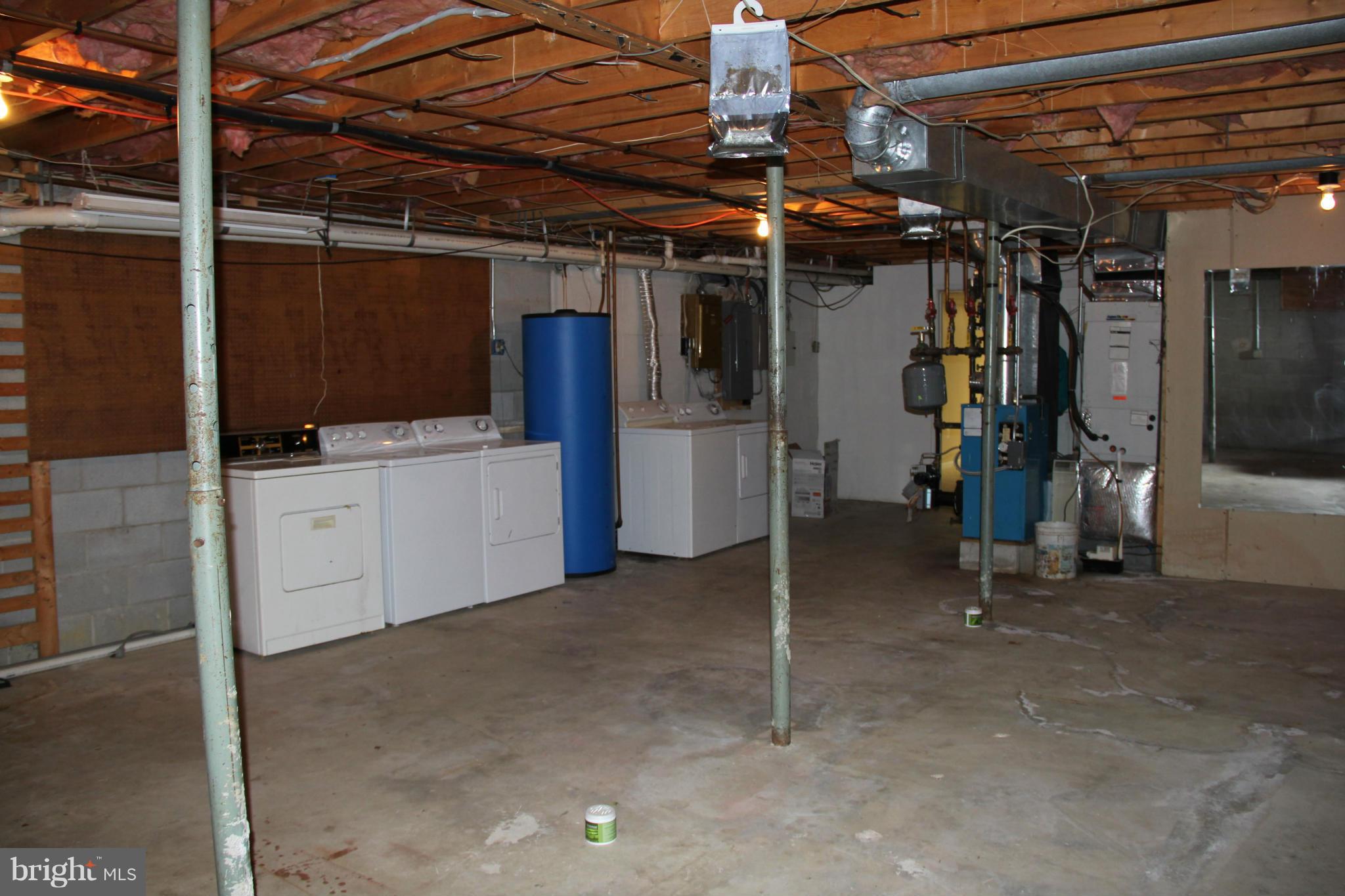 14540 Cherry Lane Ridgely, MD 21660 - Photo 22 of 30 Unfinished Area with Washers/Dyers