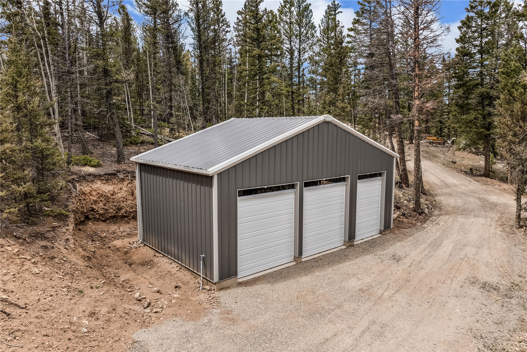 999 Bowstring Como, CO 80456 - Photo 5 of 37 a house with trees in the background