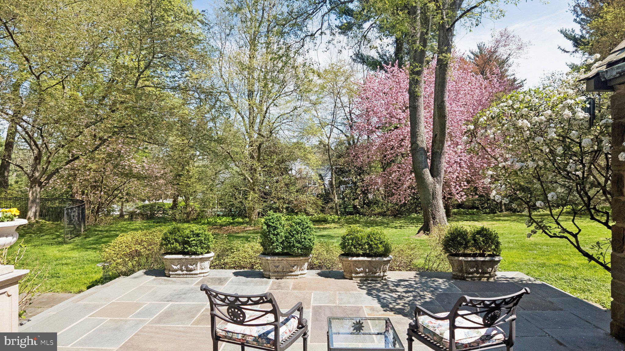 517 Fishers Road Bryn Mawr, PA 19010 - Photo 32 of 70 a backyard of a house with table and chairs