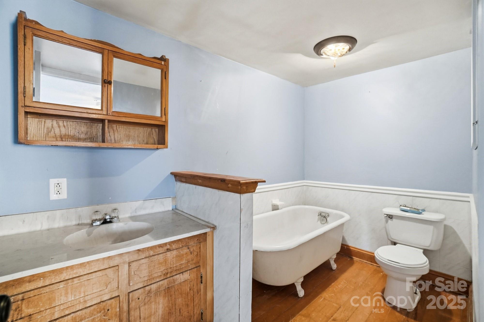 149 Swink Street Southwest Concord, NC 28027 - Photo 20 of 27 a bathroom with a sink and a toilet