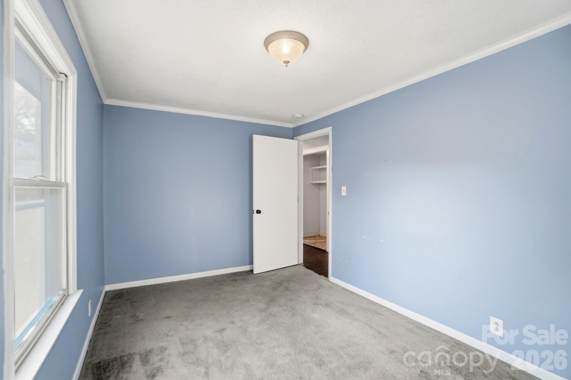 149 Swink Street Southwest Concord, NC 28027 - Photo 20 of 24 a view of an empty room with a window