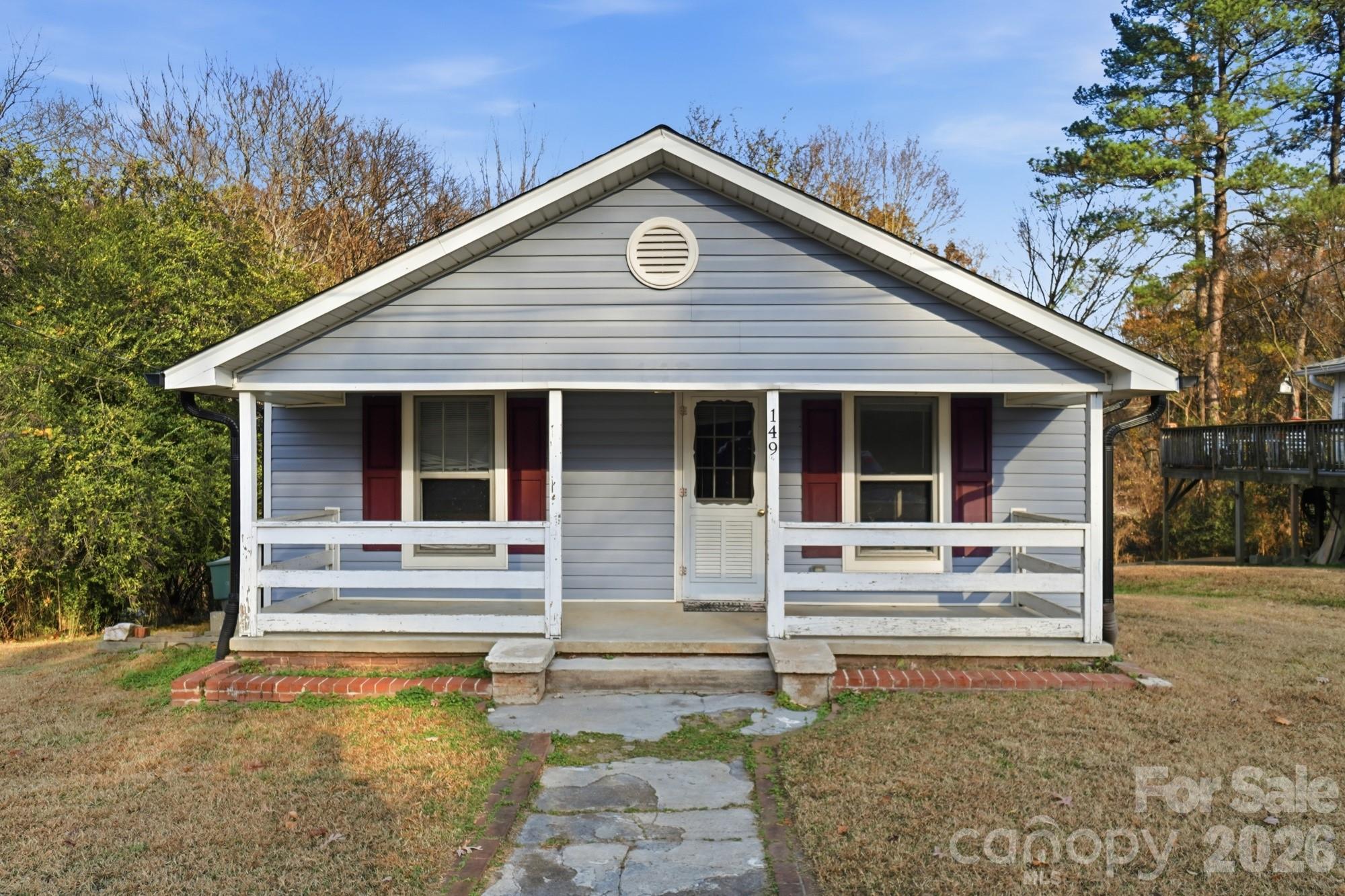 149 Swink Street Southwest Concord, NC 28027 - Photo 2 of 24 a front view of a house with garden