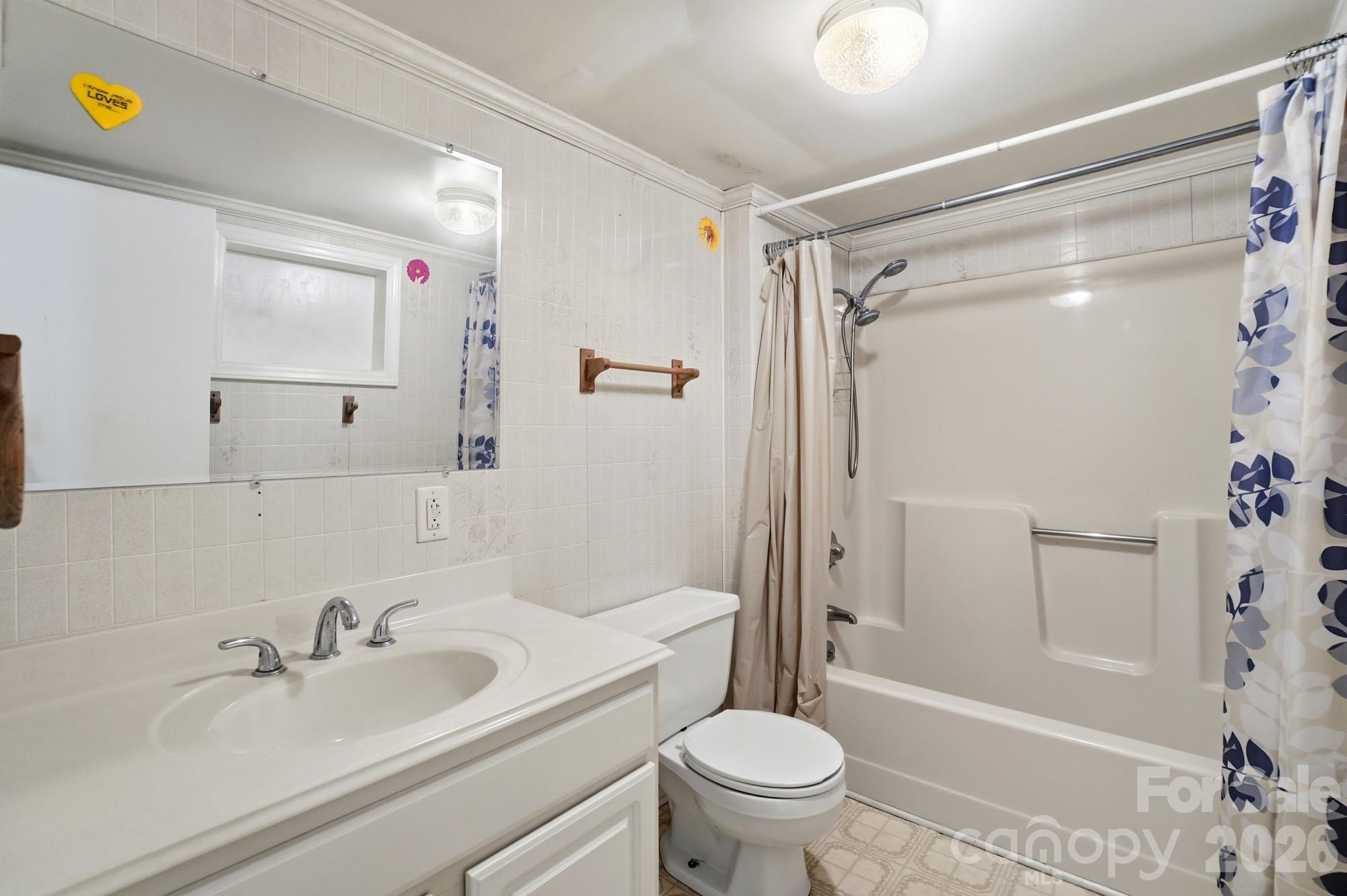 149 Swink Street Southwest Concord, NC 28027 - Photo 21 of 24 a bathroom with a sink and a mirror