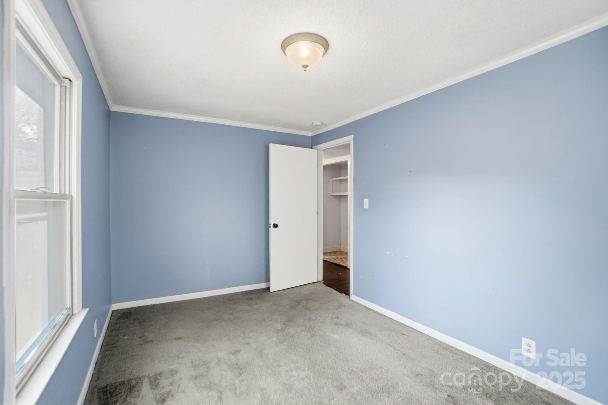 149 Swink Street Southwest Concord, NC 28027 - Photo 22 of 27 a view of an empty room with a window