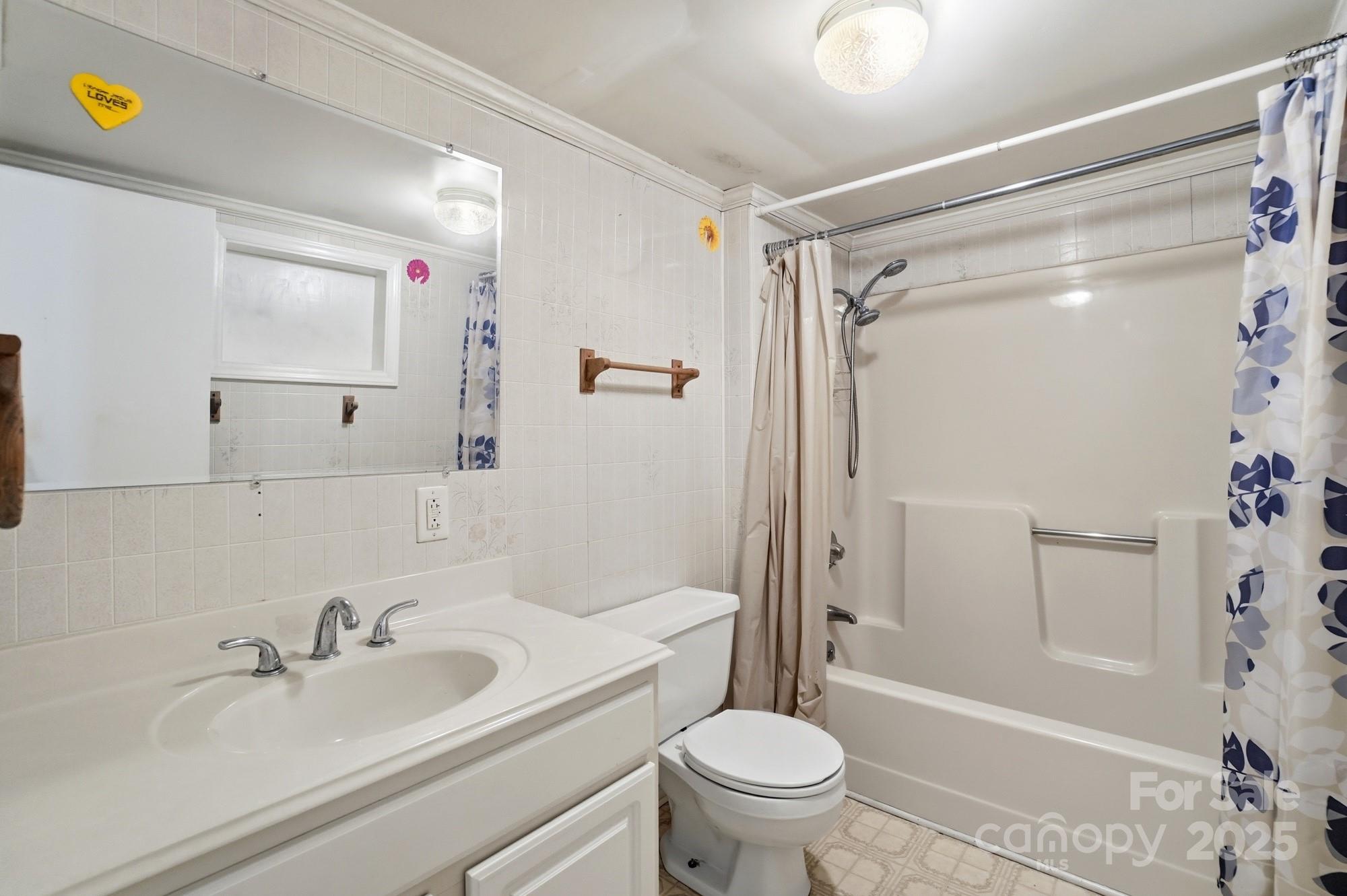 149 Swink Street Southwest Concord, NC 28027 - Photo 23 of 27 a bathroom with a sink and a mirror