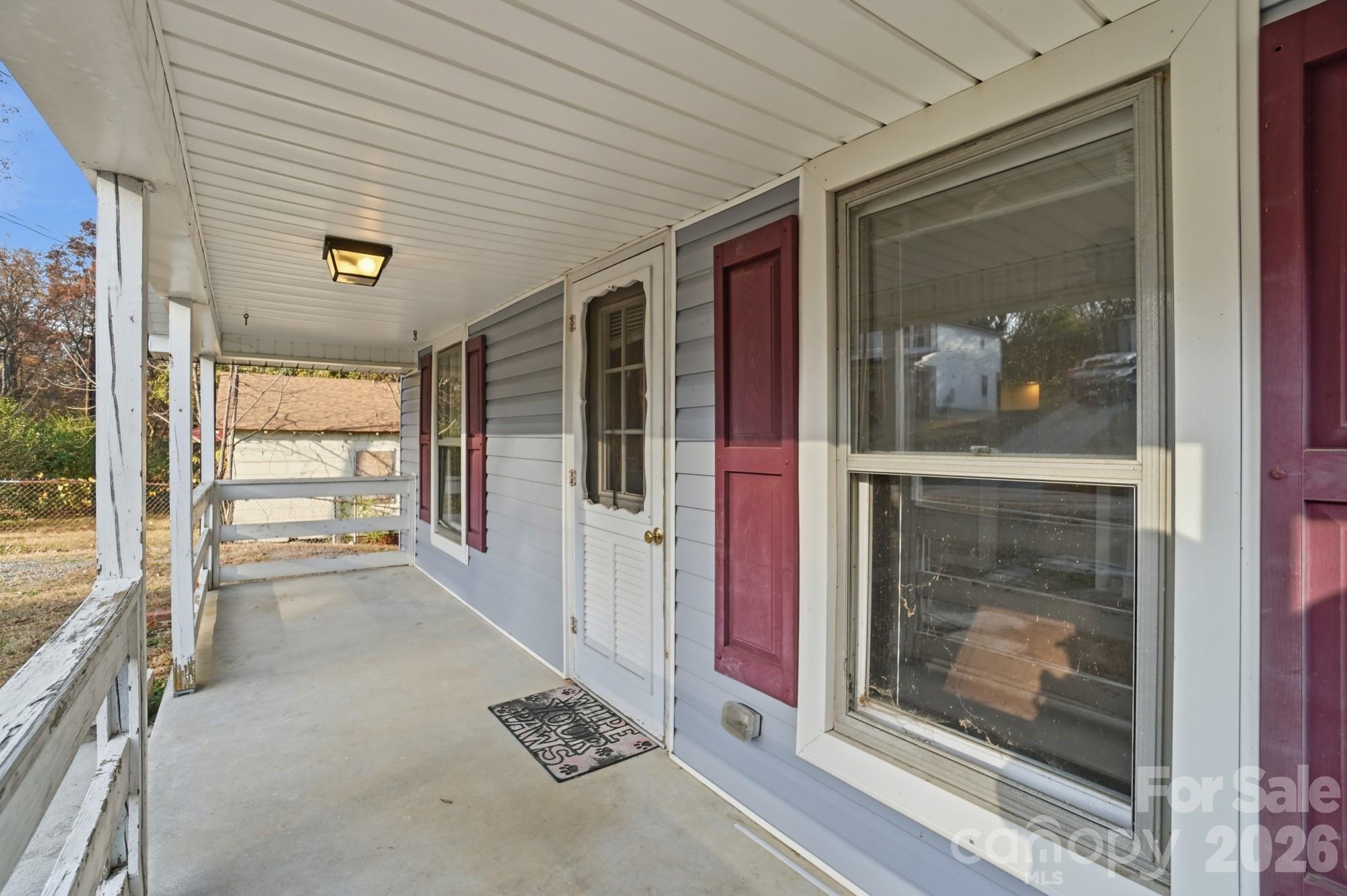 149 Swink Street Southwest Concord, NC 28027 - Photo 3 of 24 a view of a hallway with wooden floor and a large window