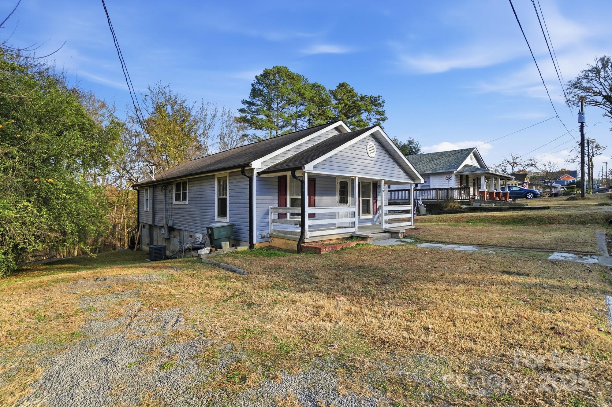 149 Swink Street Southwest Concord, NC 28027 - Photo 4 of 27 a backyard of a house with table and chairs