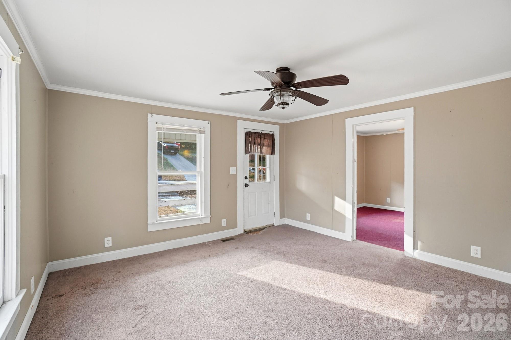 149 Swink Street Southwest Concord, NC 28027 - Photo 7 of 24 a view of a livingroom with a ceiling fan and window