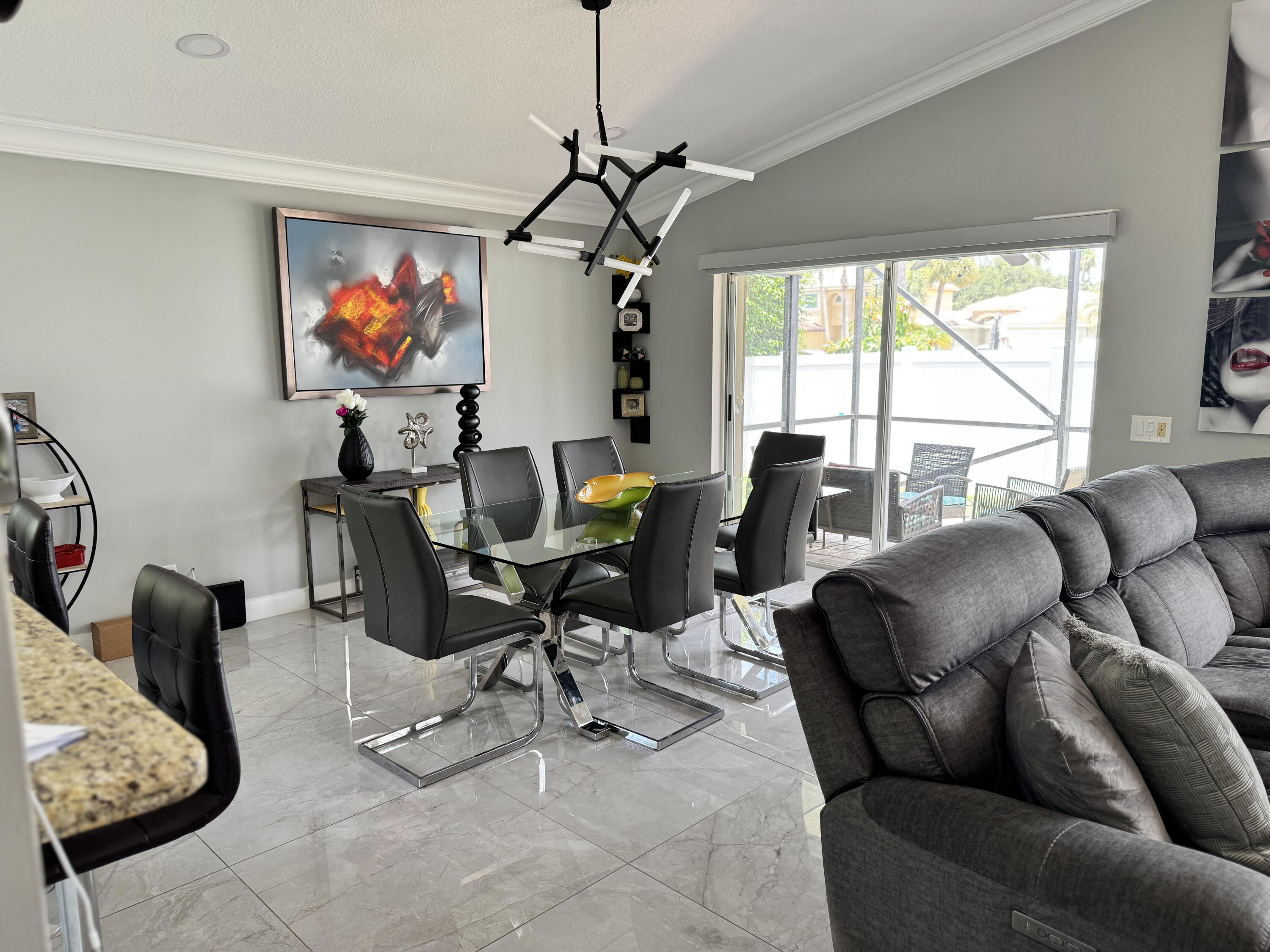 18038 Rhumba Way Boca Raton, FL 33496 - Photo 15 of 39 a living room with furniture a couch and a chandelier