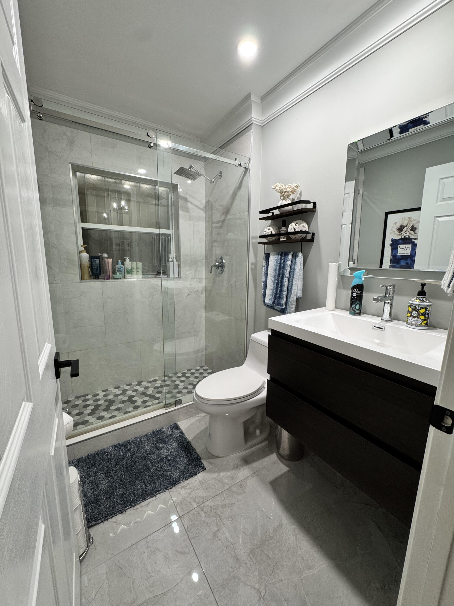 18038 Rhumba Way Boca Raton, FL 33496 - Photo 19 of 39 a bathroom with a double vanity sink toilet and shower