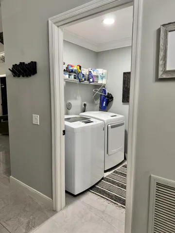 a utility room with dryer and washer
