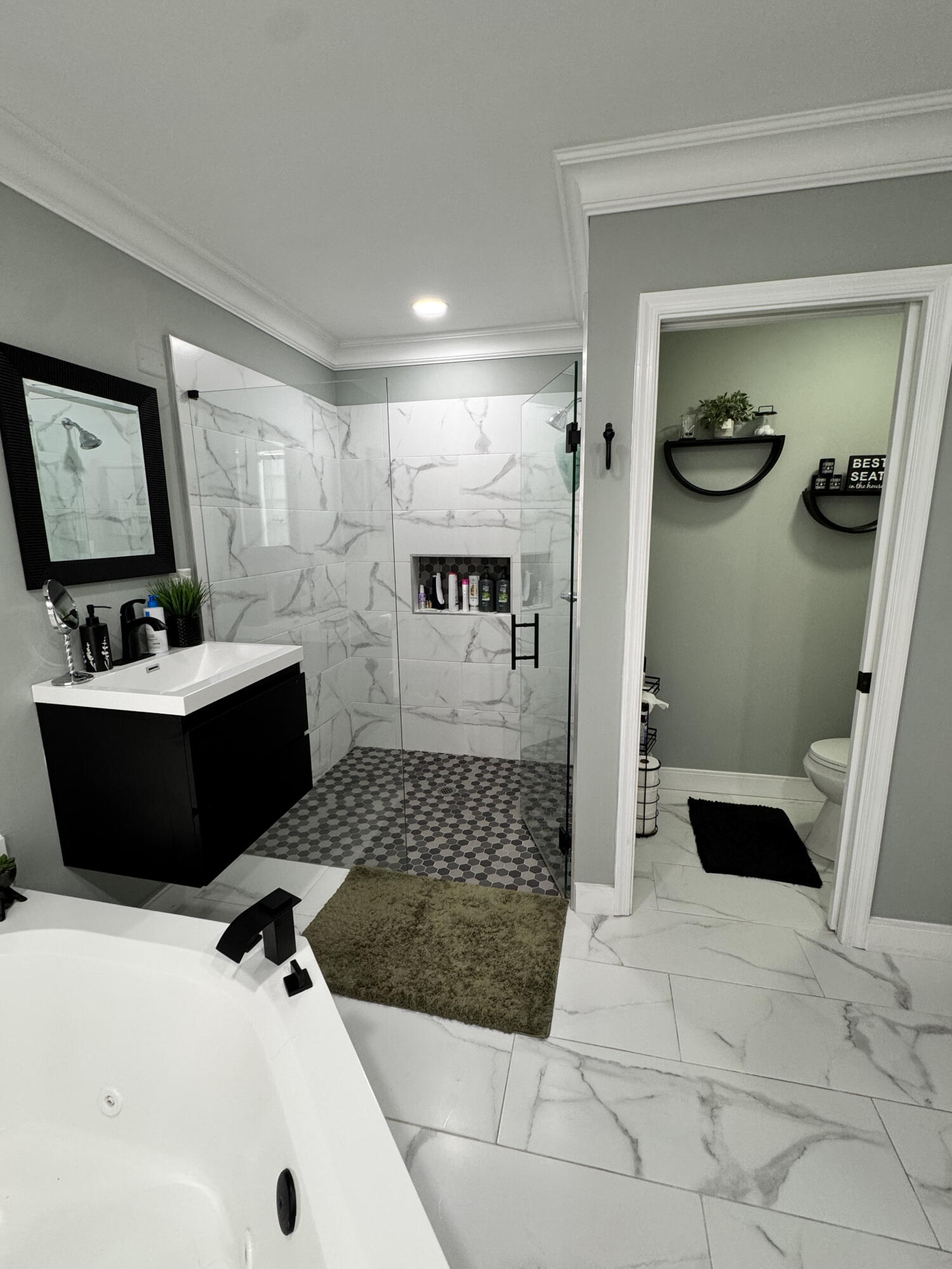 18038 Rhumba Way Boca Raton, FL 33496 - Photo 27 of 39 a bathroom with a sink a toilet and shower