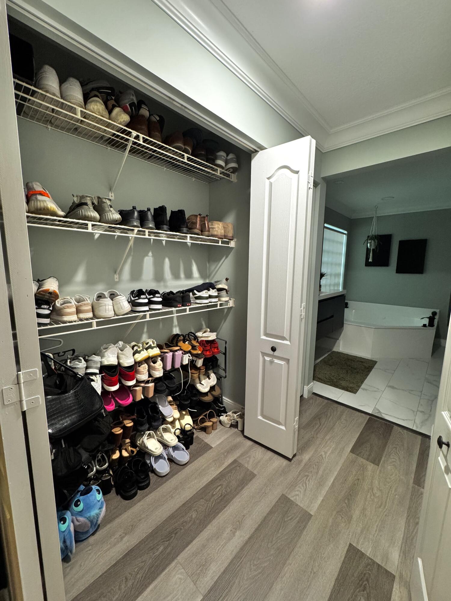 18038 Rhumba Way Boca Raton, FL 33496 - Photo 33 of 39 a room with lots of different colored cloths