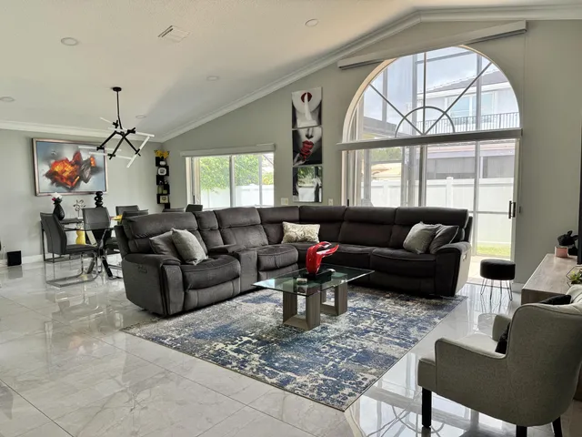 a living room with furniture or couch and a window