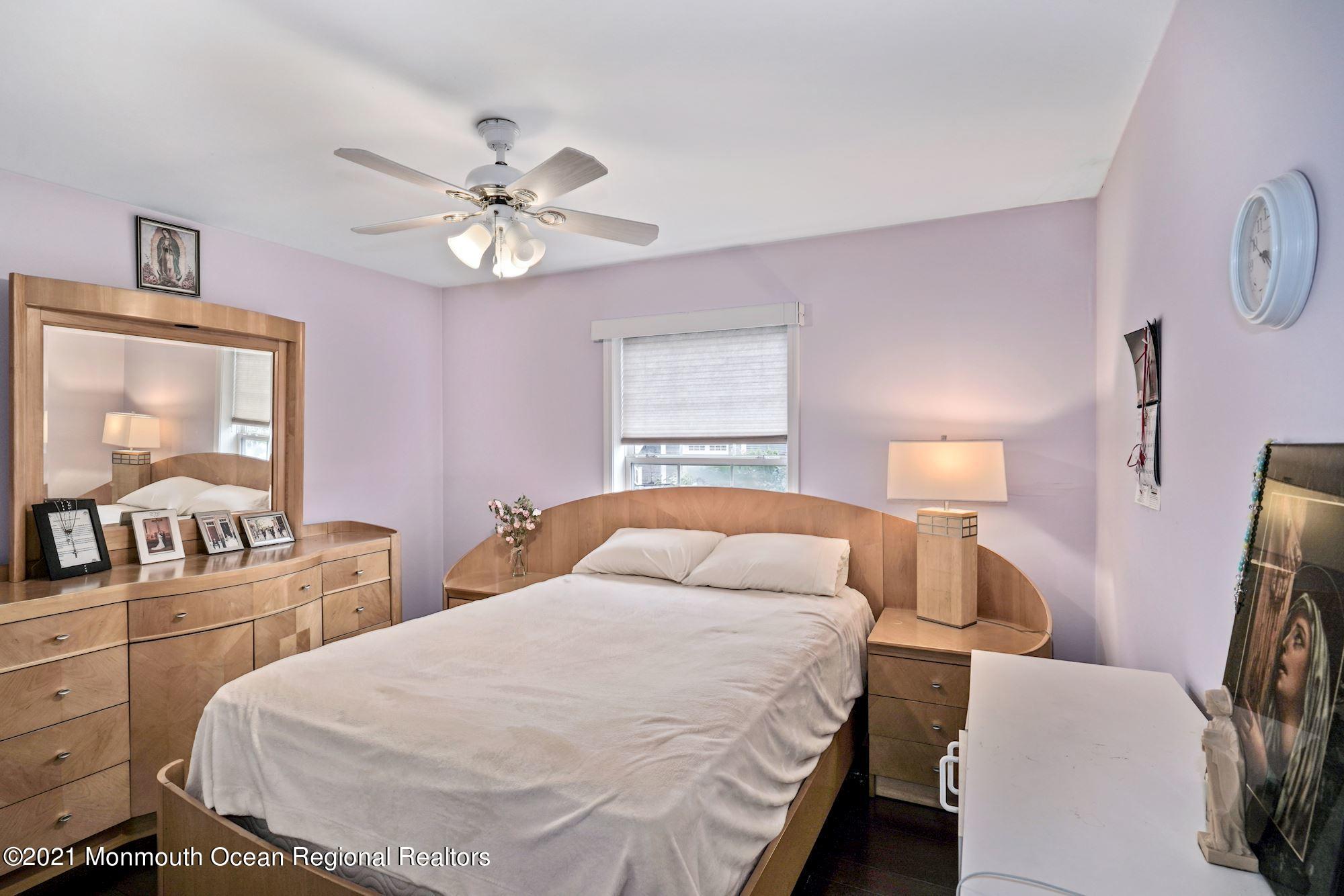 657 Drum Point Road Brick, NJ 08723 - Photo 10 of 25 a bedroom with a bed and wooden floor