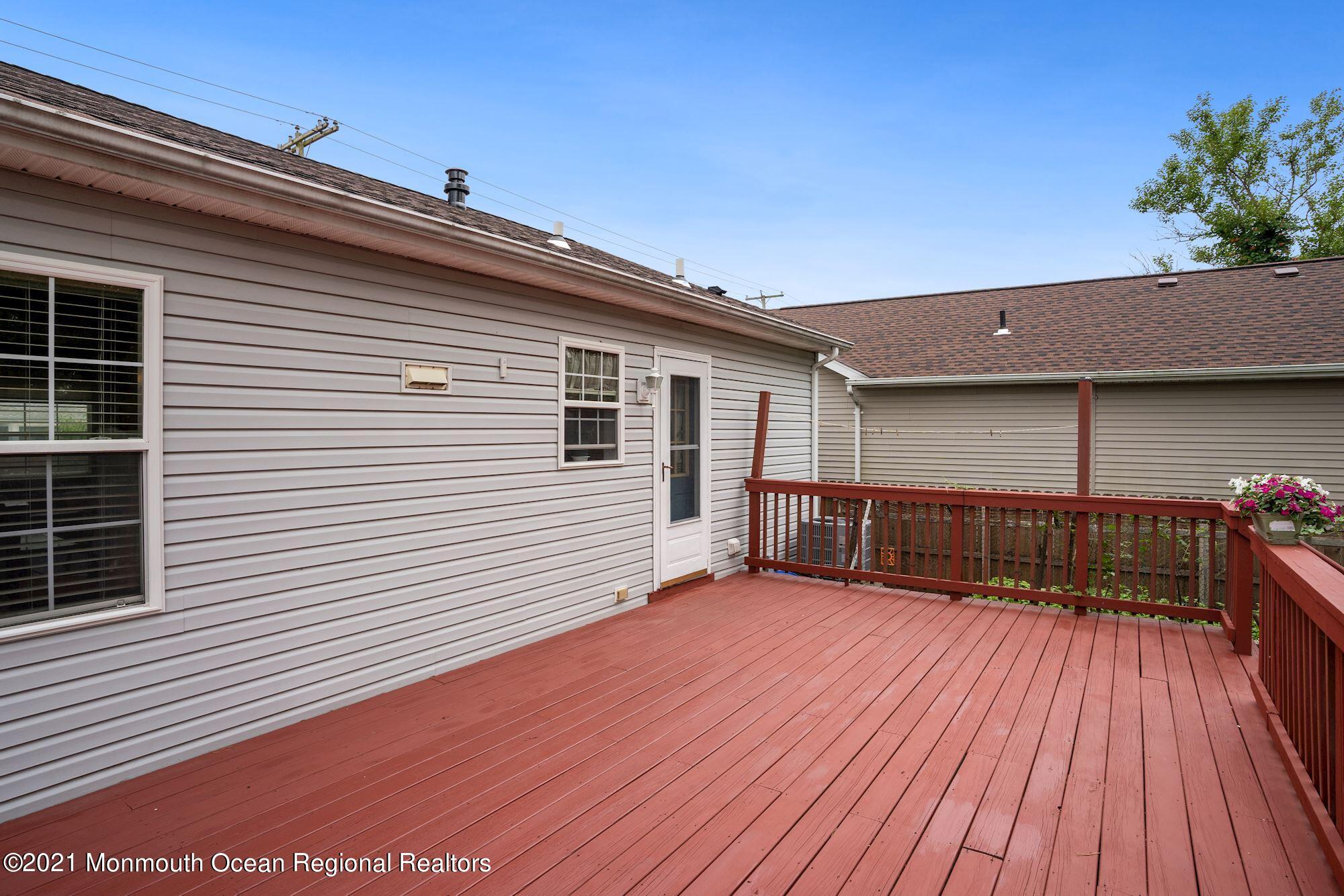 657 Drum Point Road Brick, NJ 08723 - Photo 18 of 25 a view of a house with a balcony