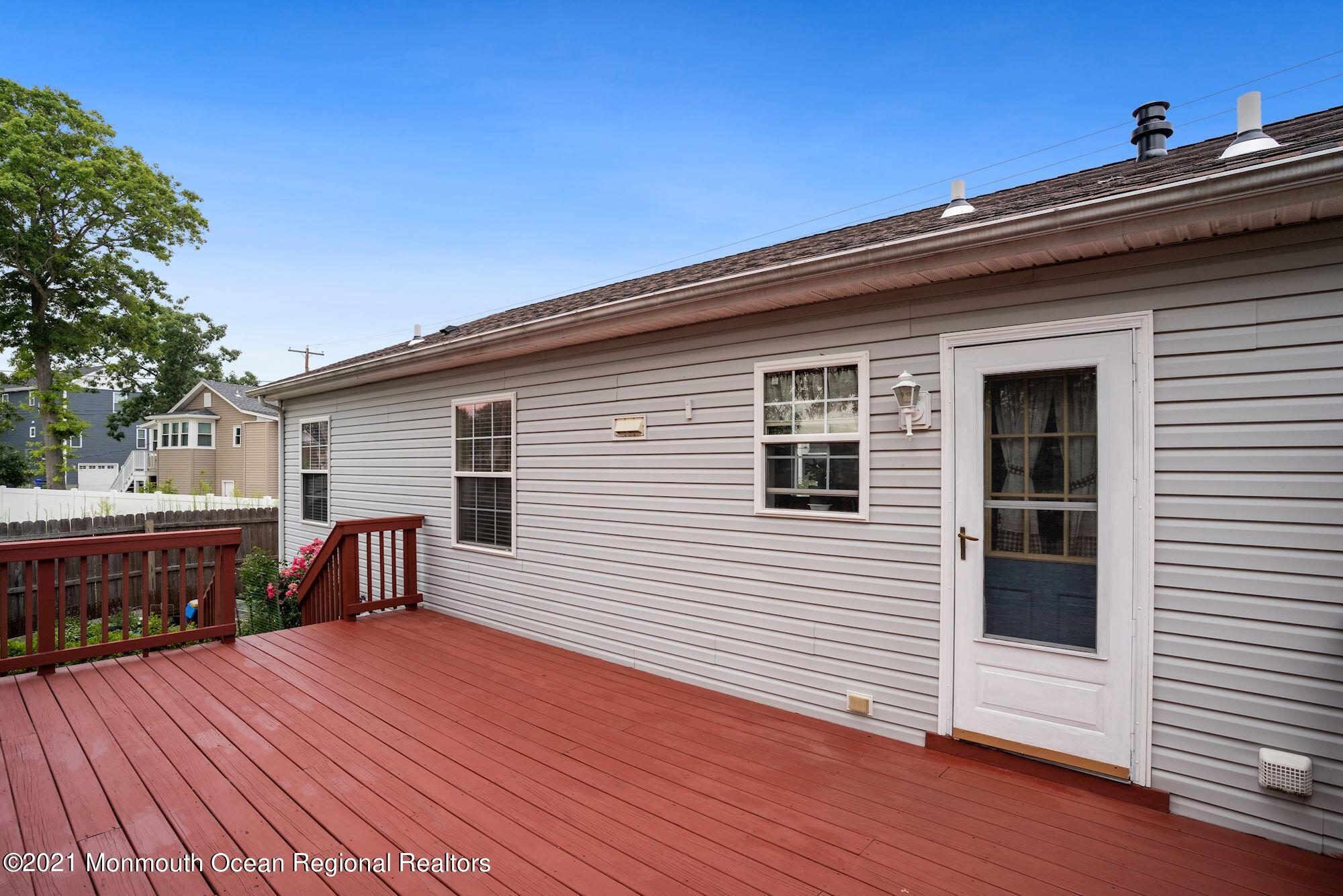 657 Drum Point Road Brick, NJ 08723 - Photo 21 of 25 a view of a house with a deck